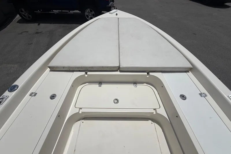 Slide: The Image of 2006 ShearWater 2200Z boat deck with storage compartments and cushioned seating. - 32