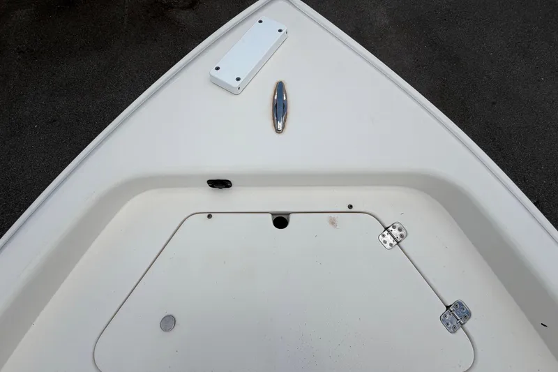Slide: The Image of Bow of 2006 ShearWater 2200Z boat with storage compartment and hardware. - 39