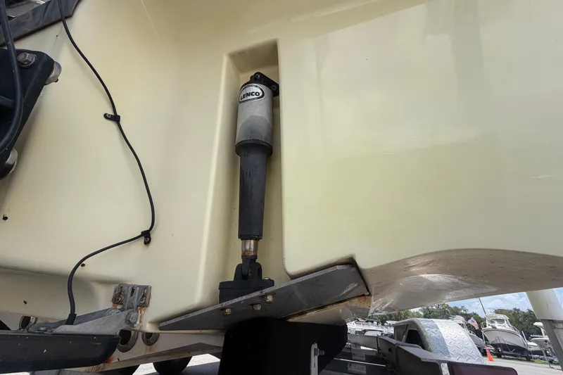 Slide: The Image of Close-up of a 2006 ShearWater 2200Z boat's Lenco trim tab actuator. - 4
