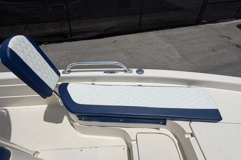 Slide: The Image of ShearWater 2200Z 2006 boat seat with blue and white diamond-patterned upholstery. - 43