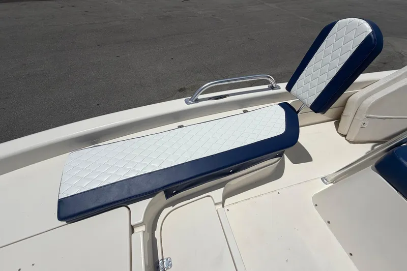 Slide: The Image of ShearWater 2200Z 2006 boat seating with blue and white diamond-pattern upholstery. - 45