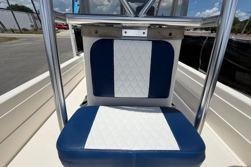 Slide: The Image of Blue and white seating on 2006 ShearWater 2200Z boat, featuring diamond-pattern upholstery. - 49