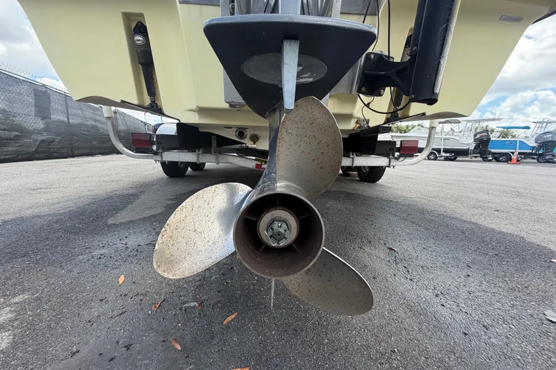 Slide: The Image of Propeller of a 2006 ShearWater 2200Z boat on a trailer, parked outdoors. - 5