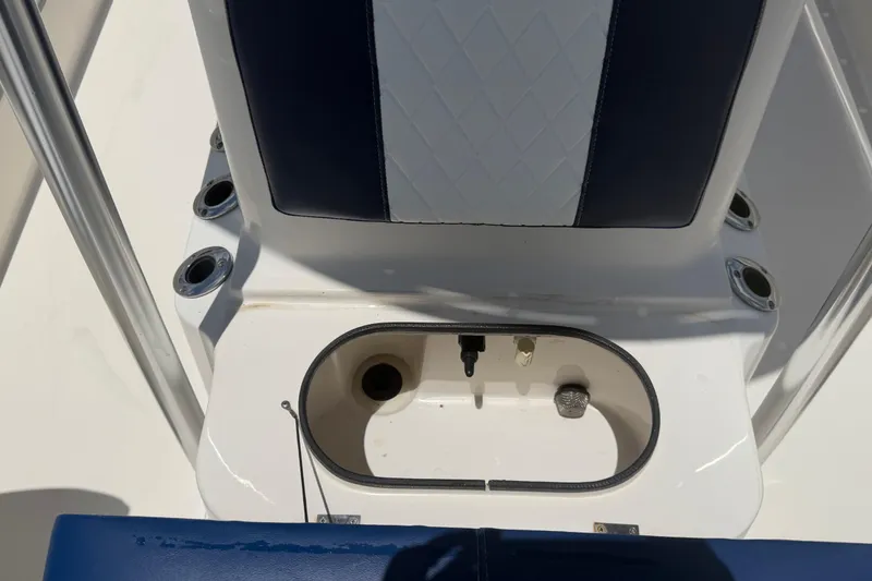 Slide: The Image of 2006 ShearWater 2200Z boat interior with seating and storage compartment. - 50