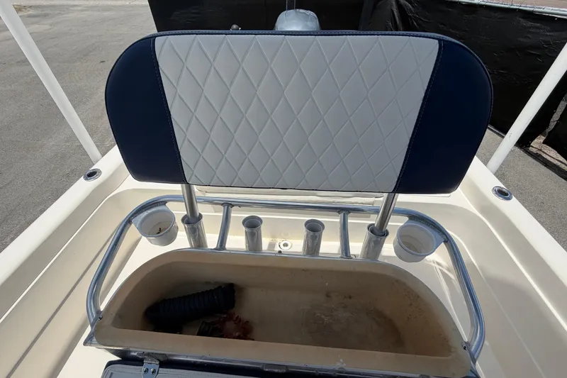 Slide: The Image of 2006 ShearWater 2200Z boat seat with rod holders and storage compartment. - 54