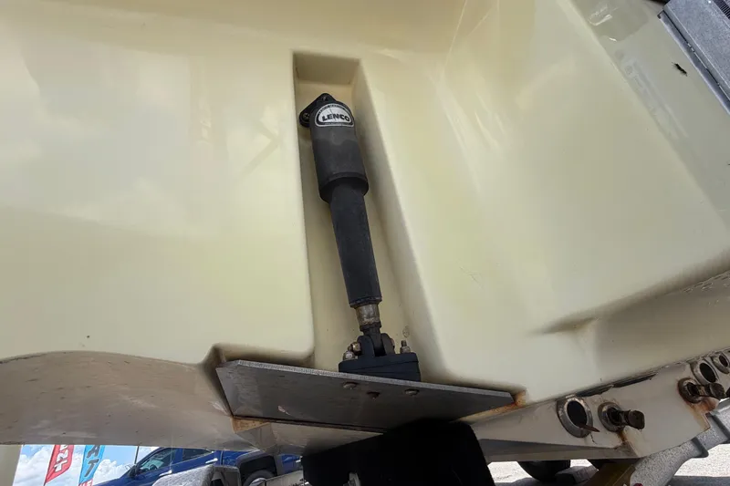 Slide: The Image of Close-up of a 2006 ShearWater 2200Z boat's Lenco trim tab actuator. - 6