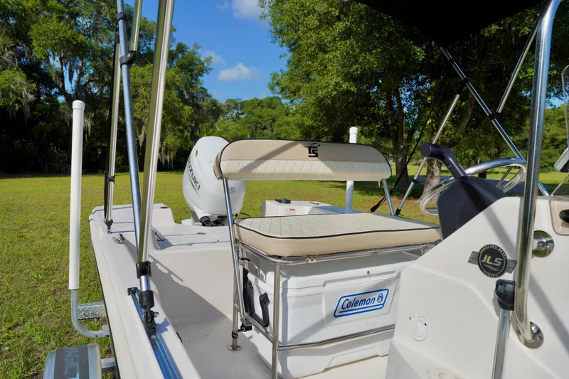 Slide: The Image of 2023 Carolina Skiff 178 JLS boat interior with seating and Coleman cooler. - 10