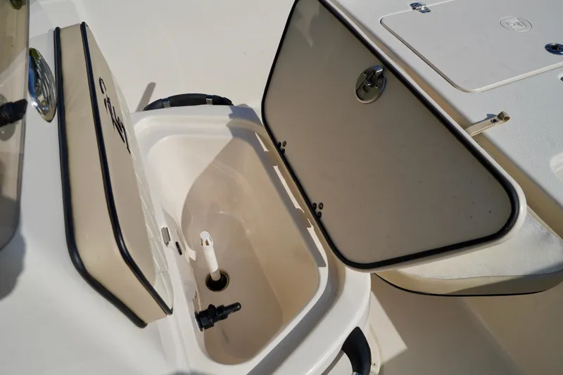 Slide: The Image of 2023 Carolina Skiff 178 JLS boat storage compartment with open hatch. - 8