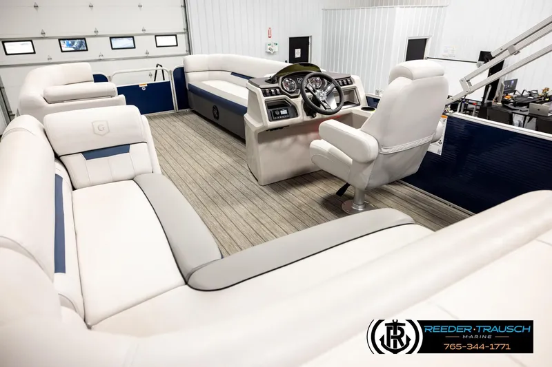 Slide: The Image of Interior of 2022 Godfrey Sweetwater 2286 pontoon boat with plush seating and modern helm. - 11