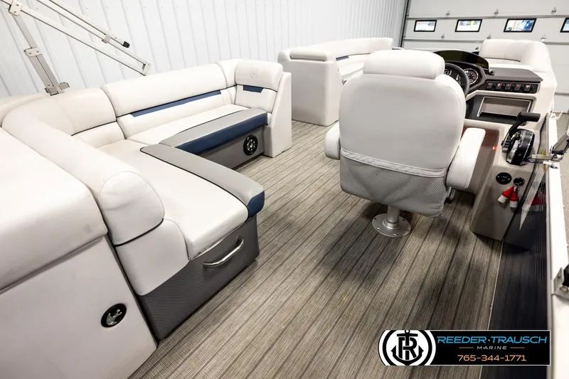 Slide: The Image of Interior of 2022 Godfrey Sweetwater 2286 pontoon boat with plush seating and modern controls. - 12