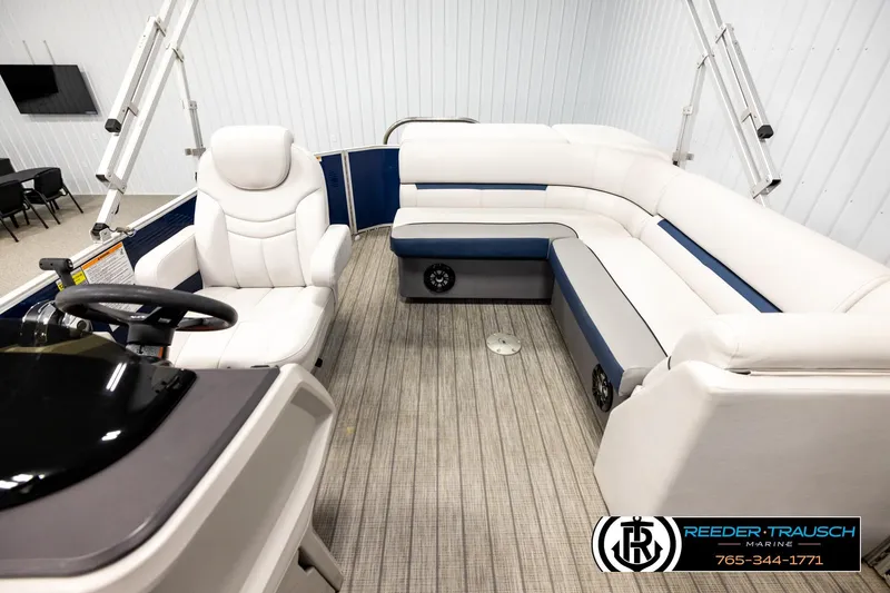 Slide: The Image of Interior of 2022 Godfrey Sweetwater 2286 pontoon boat with white seating and steering console. - 14
