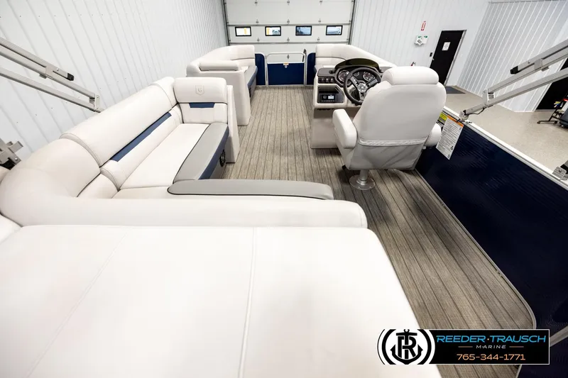 Slide: The Image of Interior of 2022 Godfrey Sweetwater 2286 pontoon boat with plush seating and modern helm. - 16
