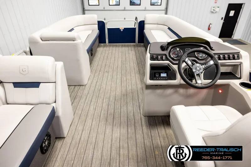 Slide: The Image of Interior of 2022 Godfrey Sweetwater 2286 pontoon boat with plush seating and modern dashboard. - 17