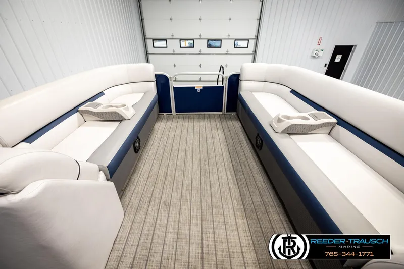 Slide: The Image of Interior of 2022 Godfrey Sweetwater 2286 pontoon boat with plush seating and cup holders. - 18