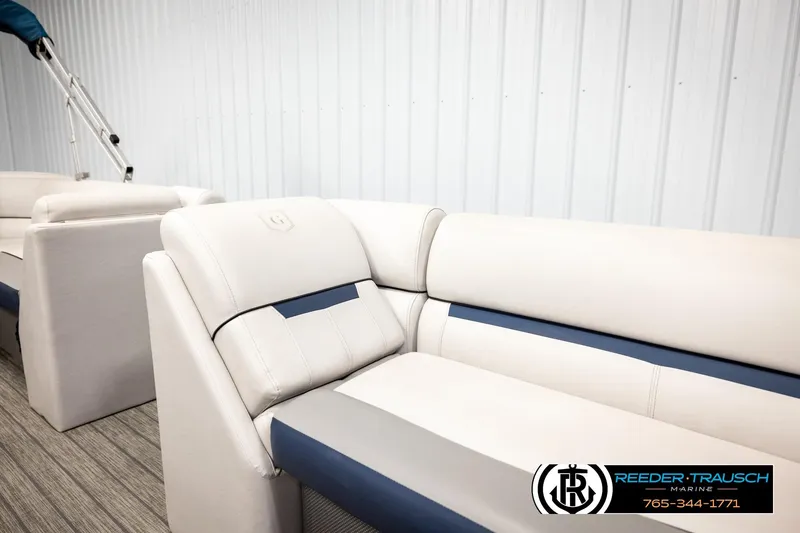 Slide: The Image of 2022 Godfrey Sweetwater 2286 boat interior with plush seating in showroom. - 26