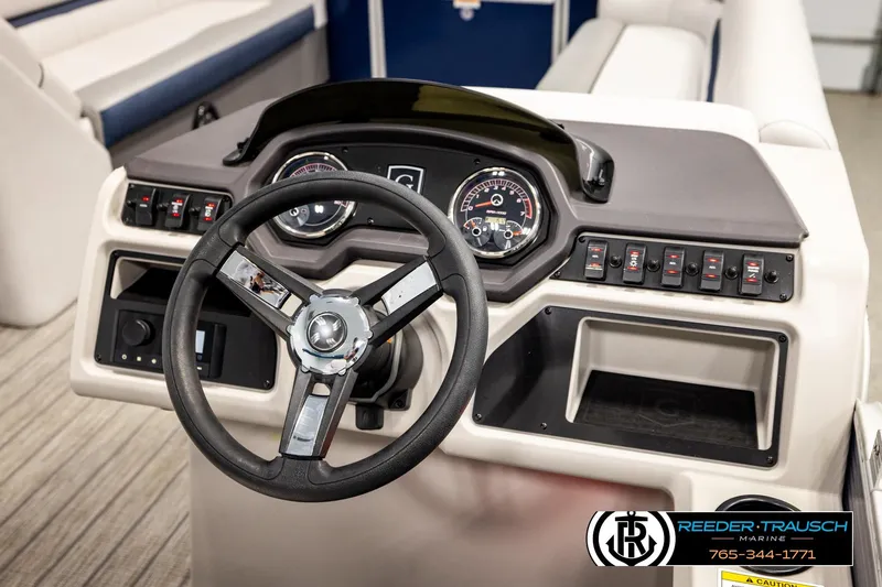 Slide: The Image of Steering console of 2022 Godfrey Sweetwater 2286 boat with gauges and controls. - 28