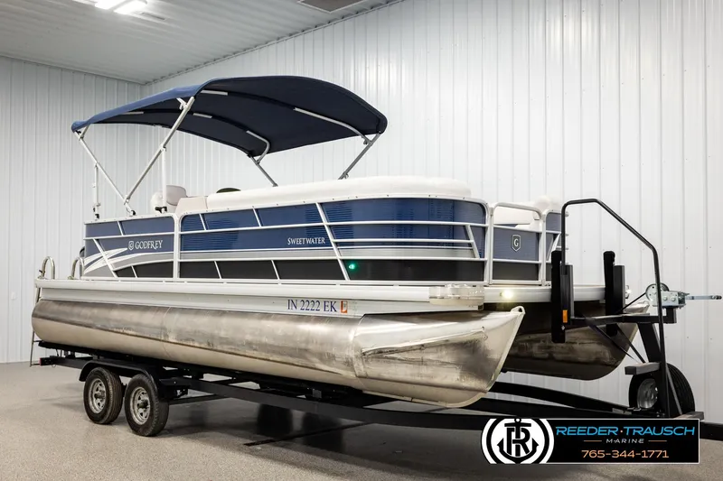 Slide: The Image of 2022 Godfrey Sweetwater 2286 pontoon boat on trailer in indoor showroom. - 3
