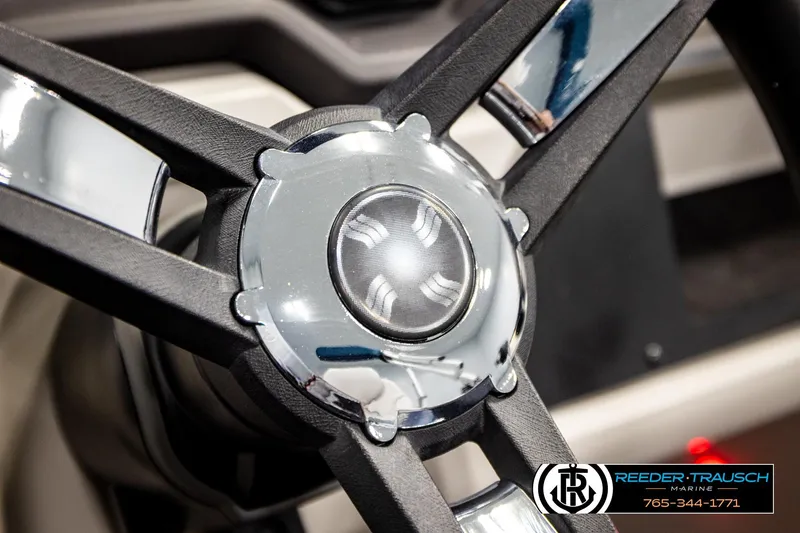 Slide: The Image of Steering wheel of 2022 Godfrey Sweetwater 2286 boat, featuring sleek chrome accents. - 30
