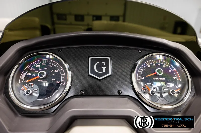 Slide: The Image of Dashboard of 2022 Godfrey Sweetwater 2286 boat with speedometer and tachometer gauges. - 33