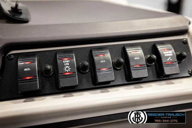 Slide: The Image of Control panel of 2022 Godfrey Sweetwater 2286 boat with labeled switches. - 35