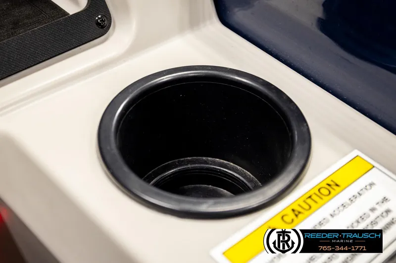 Slide: The Image of Cup holder on 2022 Godfrey Sweetwater 2286 boat with caution label and Reeder-Trausch Marine logo. - 37