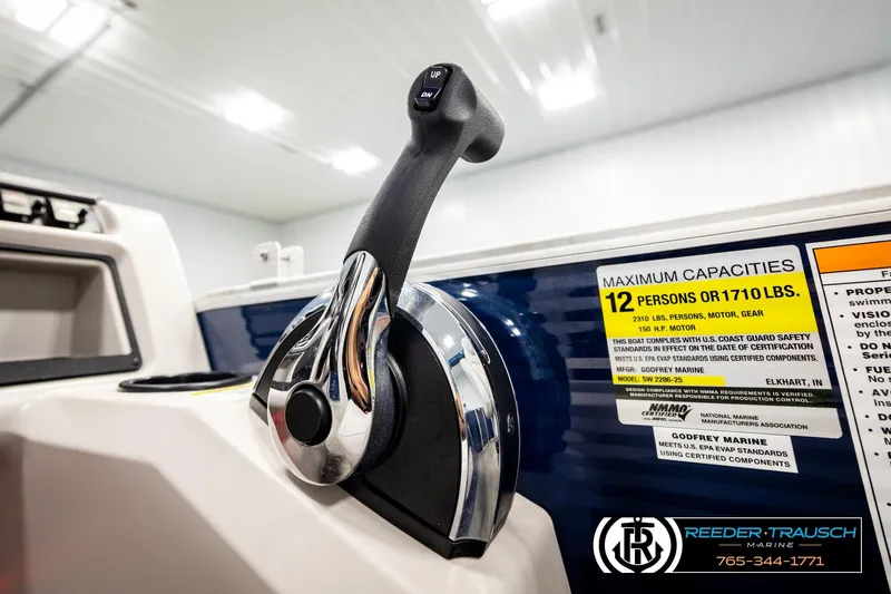 Slide: The Image of Close-up of 2022 Godfrey Sweetwater 2286 boat throttle and capacity label. - 38