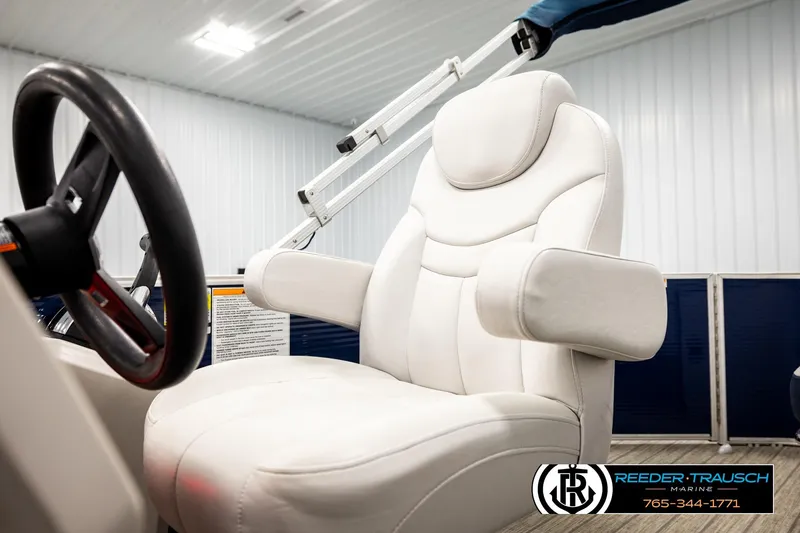 Slide: The Image of Captain's chair on 2022 Godfrey Sweetwater 2286 boat, featuring sleek white upholstery. - 39
