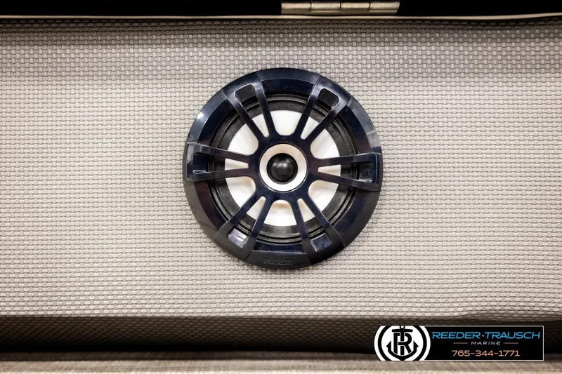 Slide: The Image of Speaker on 2022 Godfrey Sweetwater 2286 boat, textured panel background, Reeder-Trausch Marine logo. - 42