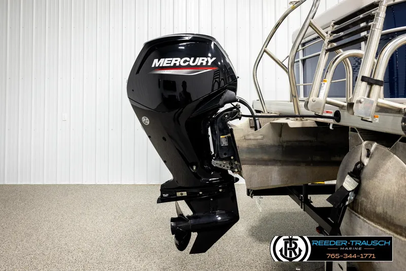 Slide: The Image of 2022 Godfrey Sweetwater 2286 with Mercury outboard motor in a showroom setting. - 43