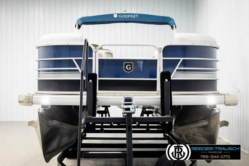 Slide: The Image of 2022 Godfrey Sweetwater 2286 pontoon boat on trailer in indoor showroom. - 8