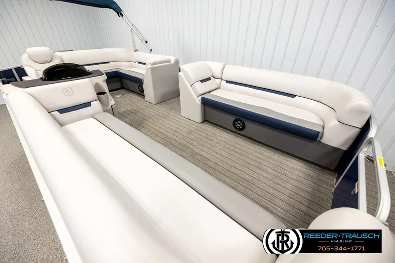 Slide: The Image of 2022 Godfrey Sweetwater 2286 pontoon boat interior with plush seating and modern design. - 9