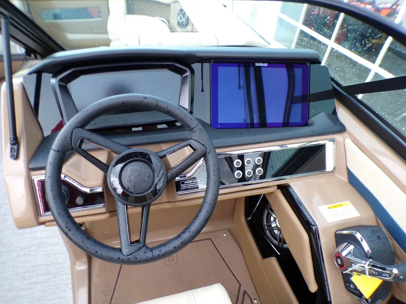 Slide: The Image of Interior of 2026 Godfrey SanPan ULW with modern steering console. - 10