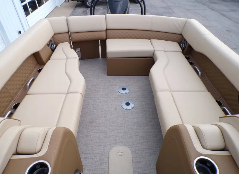 Slide: The Image of Interior of 2026 Godfrey SanPan ULW pontoon boat with beige seating. - 17