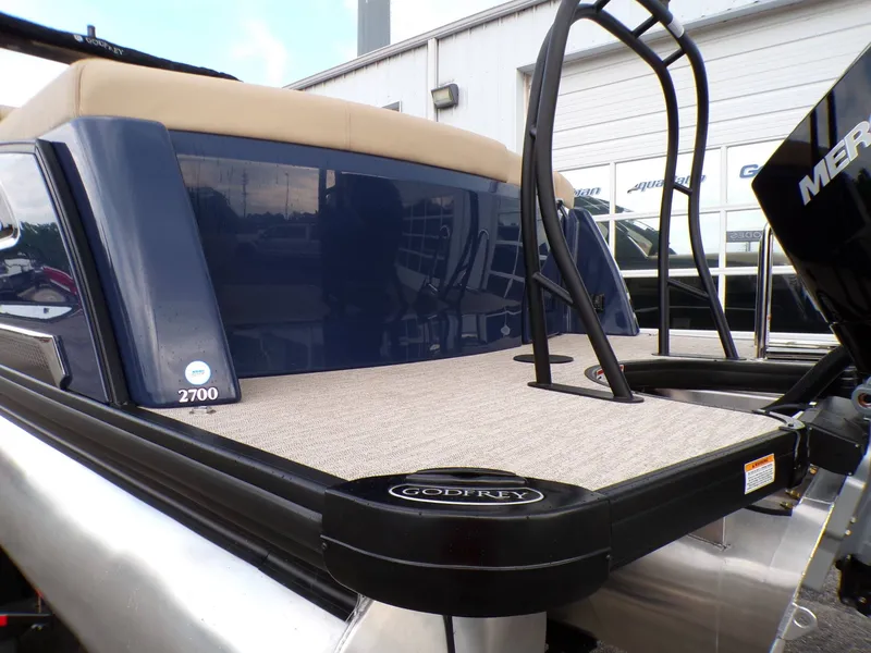 Slide: The Image of Godfrey SanPan ULW 2026 with iMPACT Plus 29" on boat deck. - 3
