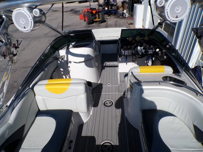 Slide: The Image of Interior of a 2005 MasterCraft X-80 boat with yellow accents. - 13