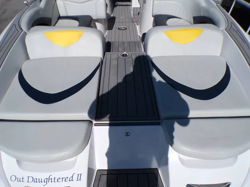 Slide: The Image of Interior of a 2005 MasterCraft X-80 boat with gray and yellow seating. - 14