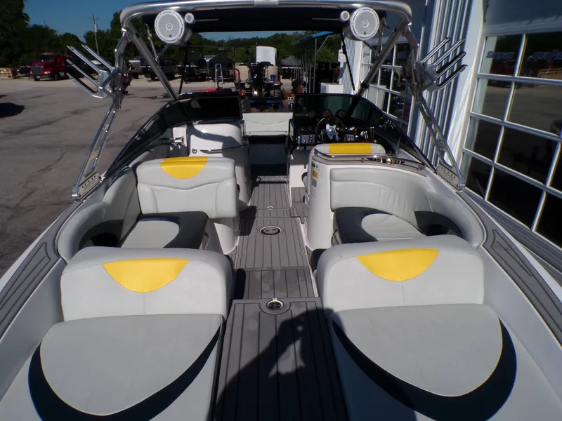 Slide: The Image of Interior of a 2005 MasterCraft X-80 boat with yellow accents. - 17