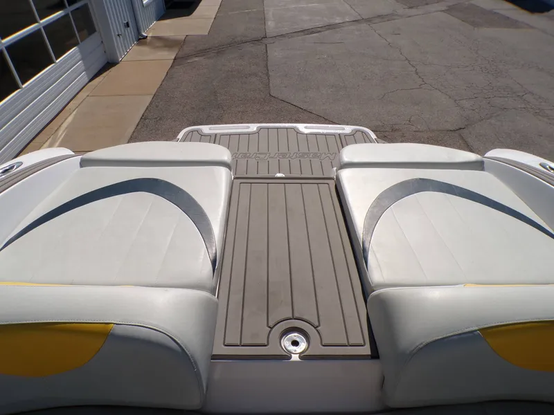 Slide: The Image of Rear view of a 2005 MasterCraft X-80 boat with cushioned seats. - 20