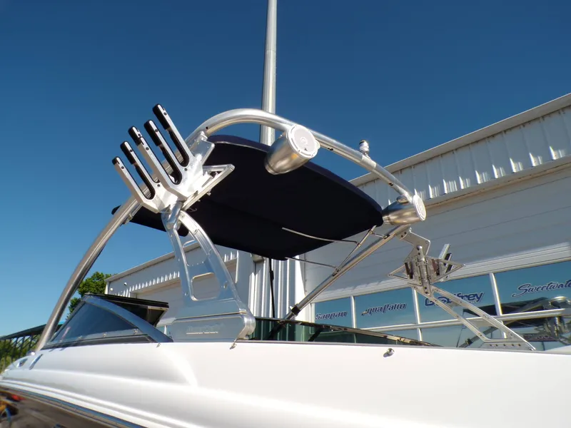 Slide: The Image of 2005 MasterCraft X-80 boat with wakeboard tower against blue sky. - 6