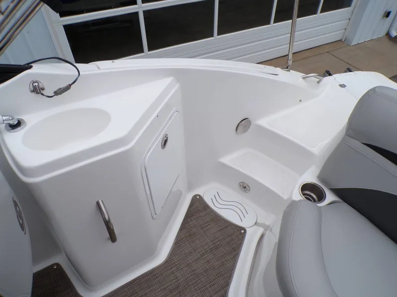 Slide: The Image of Interior of a 2018 Hurricane 2400 SD boat with seating area. - 19