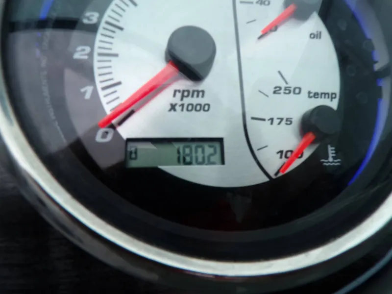 Slide: The Image of Tachometer of a 2018 Hurricane 2400 SD boat, displaying 1802 hours. - 25