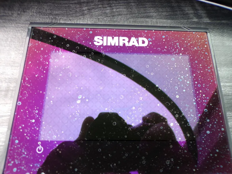 Slide: The Image of Simrad display on a 2018 Hurricane 2400 SD boat. - 26