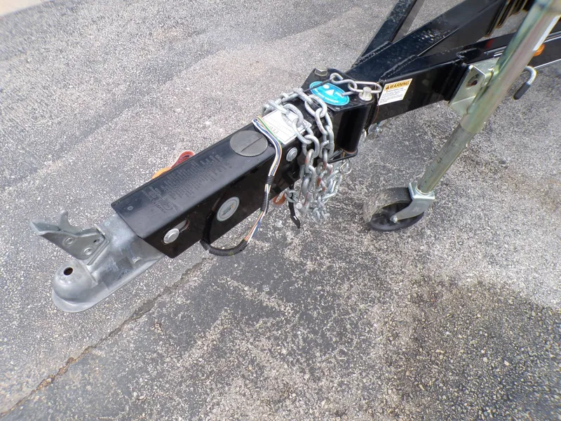 Slide: The Image of Trailer hitch of a 2018 Hurricane 2400 SD with safety chains. - 28