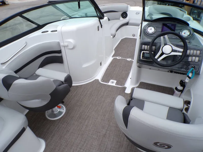 Slide: The Image of Interior of a 2018 Hurricane 2400 SD boat with gray seating. - 9