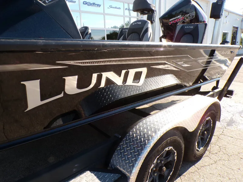 Slide: The Image of 2019 Lund 2075 Pro V Bass XS boat on trailer. - 5