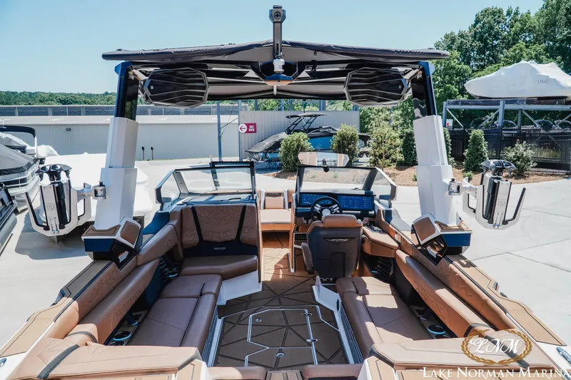 Slide: The Image of 2024 Nautique Super Air Nautique G25 Paragon interior with luxurious seating and advanced controls. - 10