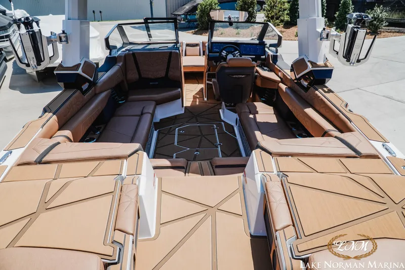 Slide: The Image of 2024 Nautique Super Air Nautique G25 Paragon interior with luxurious seating and modern design. - 11