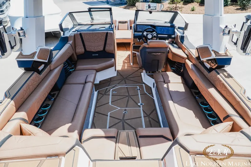 Slide: The Image of Luxurious interior of 2024 Nautique Super Air Nautique G25 Paragon boat, featuring premium seating. - 12