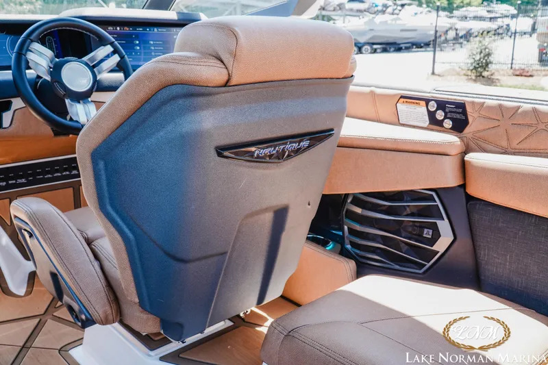 Slide: The Image of 2024 Nautique Super Air Nautique G25 Paragon interior with luxurious seating and modern dashboard. - 20