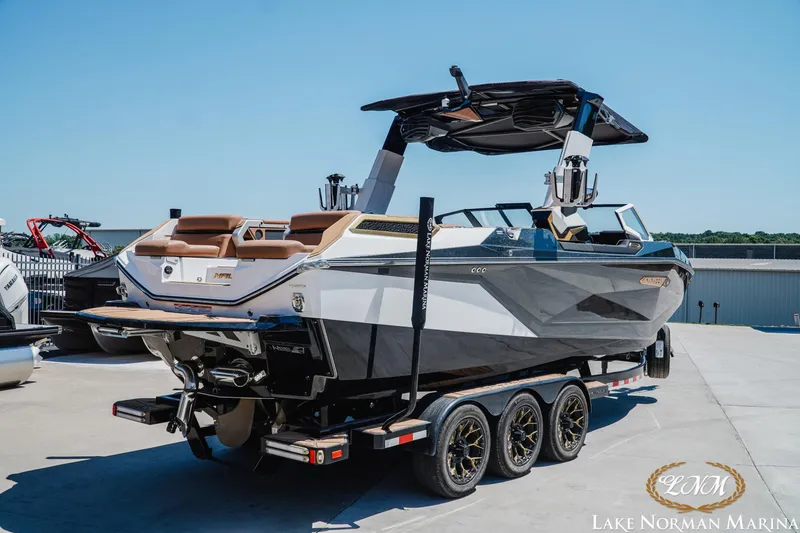 Slide: The Image of 2024 Nautique Super Air Nautique G25 Paragon boat on trailer at Lake Norman Marina. - 23